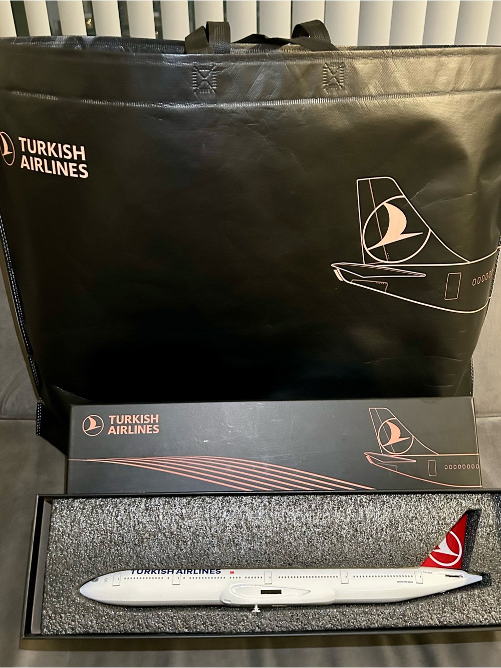 Black Travel Tote with Collectible Model Airplane